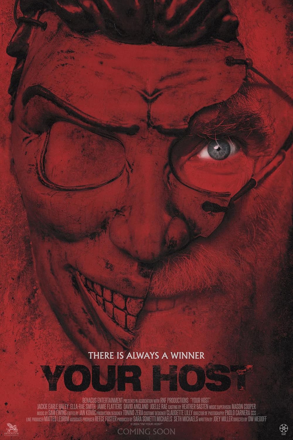 Movie poster for Your Host. The titular villain and his half mask, all in red, with a glimmering blue eye.