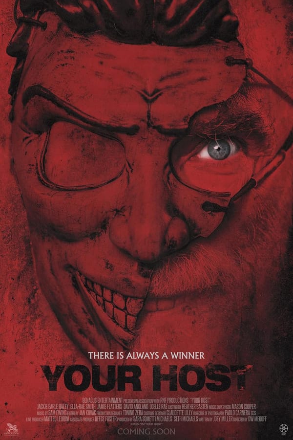Movie poster for Your Host. The titular villain and his half mask, all in red, with a glimmering blue eye.